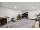 A spacious living room with wood flooring, an office area and a media center creates a versatile and functional space at 3930 Maranatha Cir, Las Vegas, NV 89103