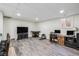 This is a versatile living room with wood flooring and multiple furniture arrangements for various uses at 3930 Maranatha Cir, Las Vegas, NV 89103