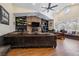 Comfortable living room featuring a brick fireplace, built-in bookcases, and hardwood floors at 3930 Maranatha Cir, Las Vegas, NV 89103