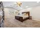 Main bedroom featuring carpet, vaulted ceiling, and window with neighborhood views at 3930 Maranatha Cir, Las Vegas, NV 89103