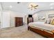 Main bedroom featuring carpet, vaulted ceiling, and dressers for storage at 3930 Maranatha Cir, Las Vegas, NV 89103