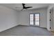 Large bedroom with new carpet and French doors leading to the backyard and pool at 3986 Belleville Ave, Las Vegas, NV 89121
