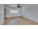 Living room showcasing natural light, modern ceiling fan, and wood flooring at 3986 Belleville Ave, Las Vegas, NV 89121