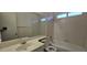 Cozy bathroom featuring a tub and shower combination with tiled walls and ample counter space at 4041 Saguaro Ln, Las Vegas, NV 89110