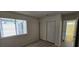 Bright bedroom with natural light, spacious closet, and view to bathroom with tub and shower at 4041 Saguaro Ln, Las Vegas, NV 89110
