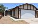 A single-Gathering home displaying its clean, painted exterior and driveway leading to a two-car garage at 4041 Saguaro Ln, Las Vegas, NV 89110