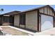 A single-Gathering home displaying its clean, painted exterior and driveway leading to a two-car garage at 4041 Saguaro Ln, Las Vegas, NV 89110