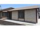 Street view of a charming stucco home with dark trim and a well-kept walkway at 4041 Saguaro Ln, Las Vegas, NV 89110