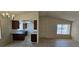 Open-concept living room and kitchen with laminate flooring at 4041 Saguaro Ln, Las Vegas, NV 89110
