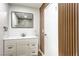 Modern bathroom with stylish vanity, framed mirror, and sleek fixtures near an adjacent accent wall at 408 Bolsa Dr, Las Vegas, NV 89110