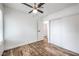 Light bedroom with wood-look floors, closet, and a window; perfect for personalization and relaxation at 408 Bolsa Dr, Las Vegas, NV 89110