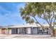 Beautiful single-story home with a tree in front, a freshly painted exterior, and gravel landscaping at 408 Bolsa Dr, Las Vegas, NV 89110