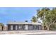 Lovely single-story home with white trim, gravel landscaping, and a shaded front yard at 408 Bolsa Dr, Las Vegas, NV 89110