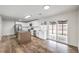 Modern kitchen featuring stainless steel appliances, an island with seating, and sliding glass doors to the backyard at 408 Bolsa Dr, Las Vegas, NV 89110