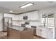Stylish kitchen with stainless steel appliances, an island with bar seating, and ample cabinet space at 408 Bolsa Dr, Las Vegas, NV 89110