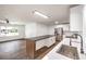 Well-lit kitchen boasts an island with a contrasting countertop, stainless steel appliances, and ample cabinet space at 408 Bolsa Dr, Las Vegas, NV 89110