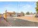 Expansive backyard with both a covered patio area and open gravel space, ideal for outdoor activities and gardening at 4201 Sunrise Ave, Las Vegas, NV 89110