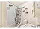 Cozy bathroom featuring a shower-over-tub combo and toilet with charming decorative signs at 4201 Sunrise Ave, Las Vegas, NV 89110