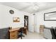 Bright bedroom features a ceiling fan, closet, desk, and mini fridge, perfect for comfortable living at 4201 Sunrise Ave, Las Vegas, NV 89110