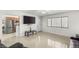 Spacious living area featuring tile floors, a large window, and an open layout at 4201 Sunrise Ave, Las Vegas, NV 89110