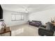 Inviting living space with tile floors, plenty of natural light, and modern furniture at 4201 Sunrise Ave, Las Vegas, NV 89110