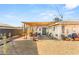 Charming covered patio features ample seating and a swing, offering a cozy outdoor retreat and entertaining space at 4201 Sunrise Ave, Las Vegas, NV 89110