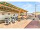 Outdoor patio with a covered pergola, seating, and a brick patio, perfect for relaxing outdoors at 4201 Sunrise Ave, Las Vegas, NV 89110