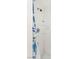Shower with white tiling, shower head, and blue-patterned shower curtain at 4201 Sunrise Ave, Las Vegas, NV 89110