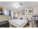 Bedroom featuring neutral decor with a comfortable bed, complemented by decorative wreaths at 4606 Powell Ave, Las Vegas, NV 89121