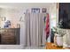 Bedroom with a dresser and curtains that act as a closet door, creating a cozy atmosphere at 4606 Powell Ave, Las Vegas, NV 89121