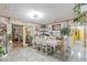 Inviting dining area filled with decor, plants, and ample natural light at 4606 Powell Ave, Las Vegas, NV 89121
