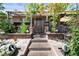 Inviting entrance with decorative brickwork, lush plants, and stepping stones leading to the main door at 4606 Powell Ave, Las Vegas, NV 89121
