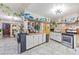 Open concept kitchen with stainless steel appliances and adjacent dining area, perfect for entertaining guests at 4606 Powell Ave, Las Vegas, NV 89121