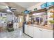 Bright kitchen with granite counters, white cabinets, and tiled floor, with access to the dining area at 4606 Powell Ave, Las Vegas, NV 89121