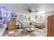 Living room showcasing a decorative ceiling fan, light-pink walls, and comfortable seating at 4606 Powell Ave, Las Vegas, NV 89121