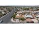Street view of a single-story home with front yard and tree, plus an overview of the neighborhood and street at 4606 Powell Ave, Las Vegas, NV 89121