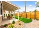 This home includes a charming backyard with synthetic grass and a covered patio area, perfect for entertaining at 4856 Fiesta Lakes St, Las Vegas, NV 89130
