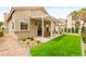 Charming home includes a covered patio, synthetic lawn, and attractive low-maintenance desert landscaping at 4856 Fiesta Lakes St, Las Vegas, NV 89130
