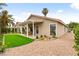 This home boasts a beautiful backyard with a covered patio, synthetic grass, and low-maintenance landscaping at 4856 Fiesta Lakes St, Las Vegas, NV 89130
