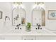 Elegant bathroom with double sinks, marble countertops, and modern fixtures at 4856 Fiesta Lakes St, Las Vegas, NV 89130