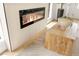 Contemporary fireplace with a wood panel surround and modern decor accents at 4856 Fiesta Lakes St, Las Vegas, NV 89130