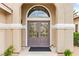 Close-up of a home's front entrance featuring a double door with decorative glass inserts at 4856 Fiesta Lakes St, Las Vegas, NV 89130