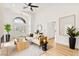 Well-lit living space with modern furniture, wood floors, and decorative plants at 4856 Fiesta Lakes St, Las Vegas, NV 89130