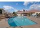 Community pool area with lounge chairs and beautiful blue water at 4856 Fiesta Lakes St, Las Vegas, NV 89130