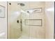 Modern shower featuring hexagon tile flooring, black hardware, and a unique rectangular window at 4856 Fiesta Lakes St, Las Vegas, NV 89130