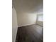Inviting bedroom with wood-look flooring and a window, offering a serene retreat at 4941 Newport Cove Dr # B, Las Vegas, NV 89119