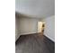 Comfortable bedroom featuring wood-look flooring and a door to connect with the rest of the house at 4941 Newport Cove Dr # B, Las Vegas, NV 89119