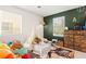 Charming bedroom with bright accent wall and playful decor at 5674 Moccasin Point St, Las Vegas, NV 89148