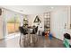 Inviting dining area with sliding glass doors to the patio, complemented by chic decor and stylish finishes at 5674 Moccasin Point St, Las Vegas, NV 89148