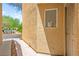 Exterior view of the front door, side yard, and landscaped walkway at 5674 Moccasin Point St, Las Vegas, NV 89148